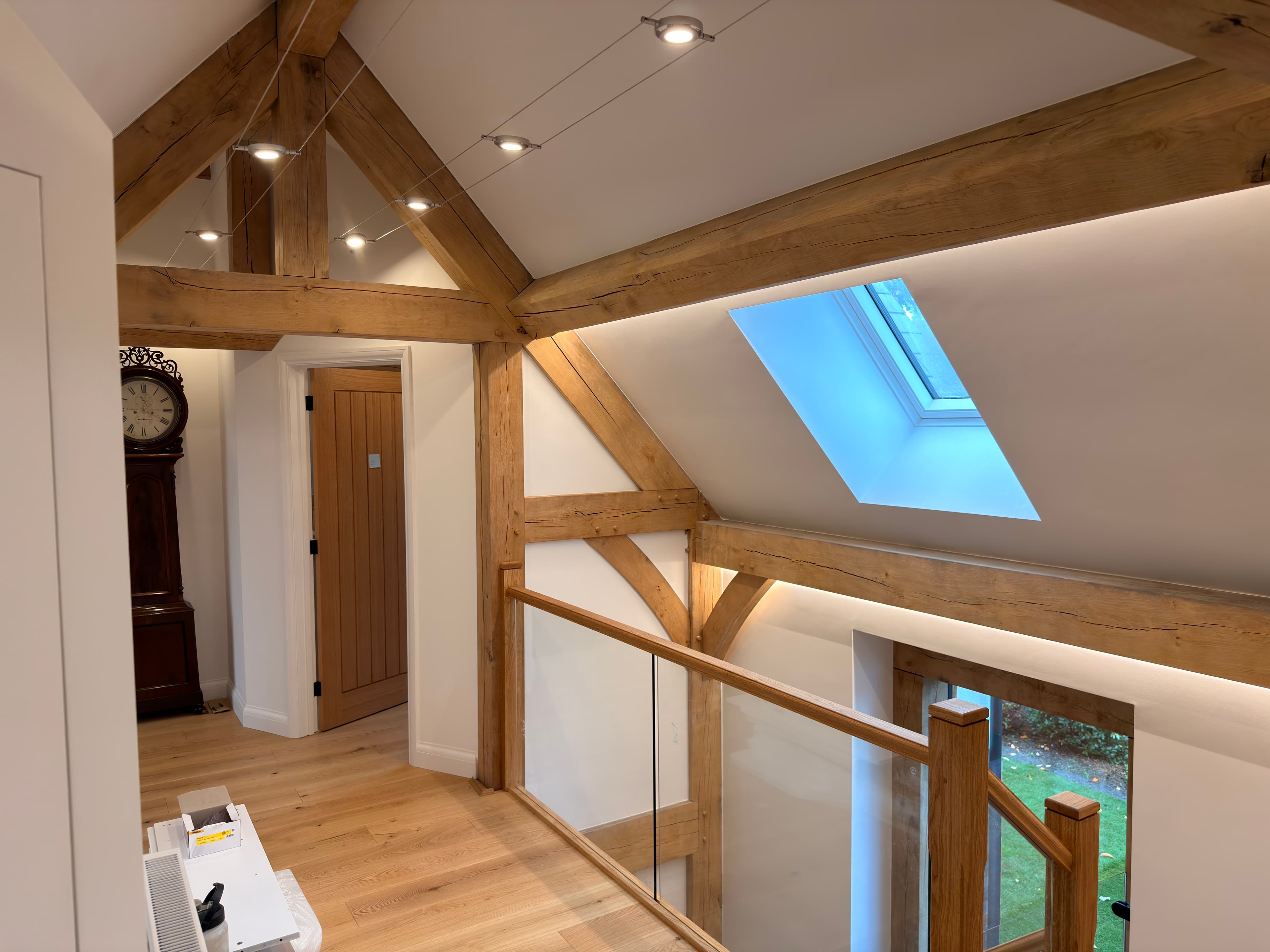 Oak-framed vaulted landing with glazed balustrade