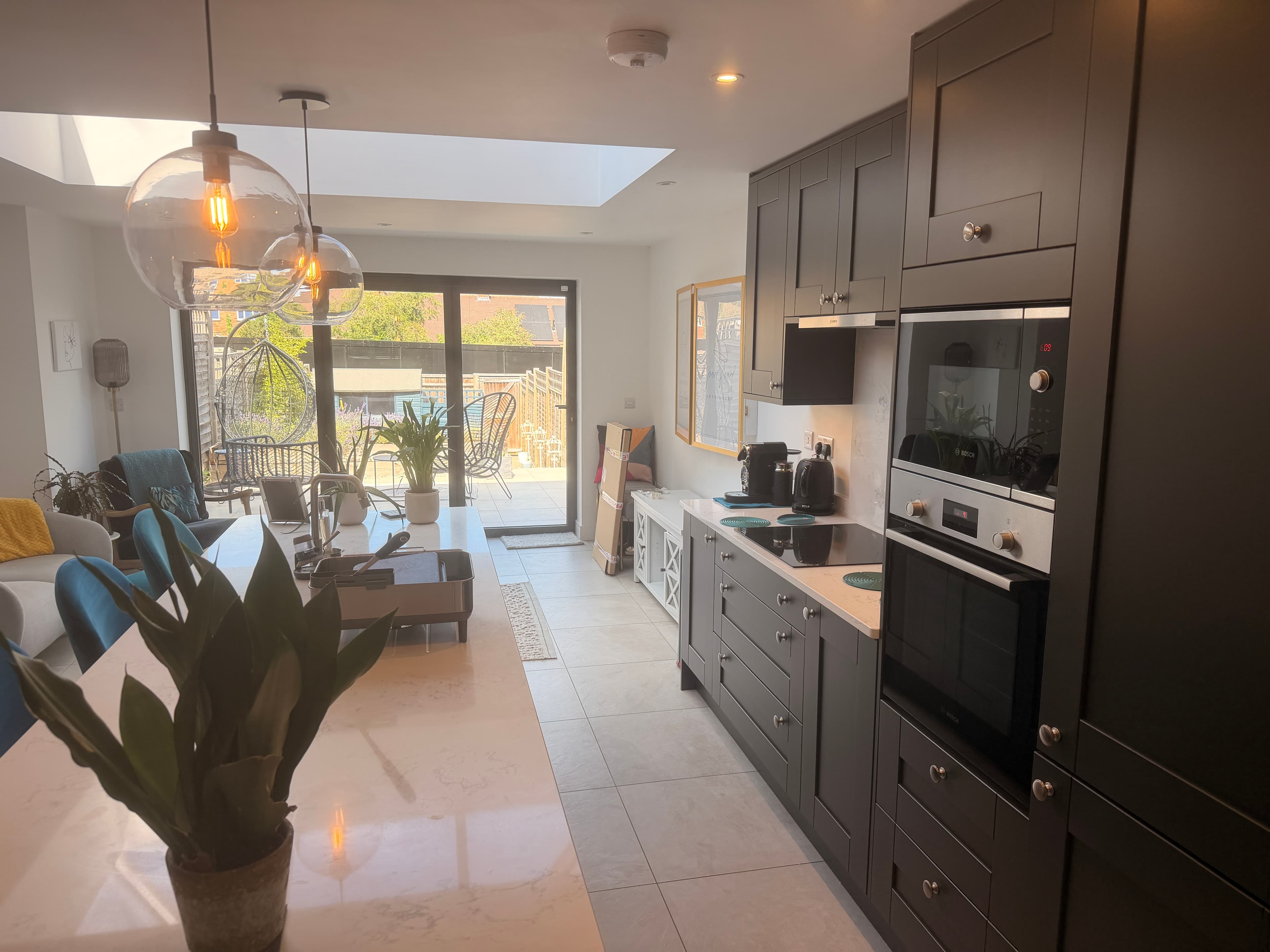 Graphite shaker cabinetry and quartz worktops