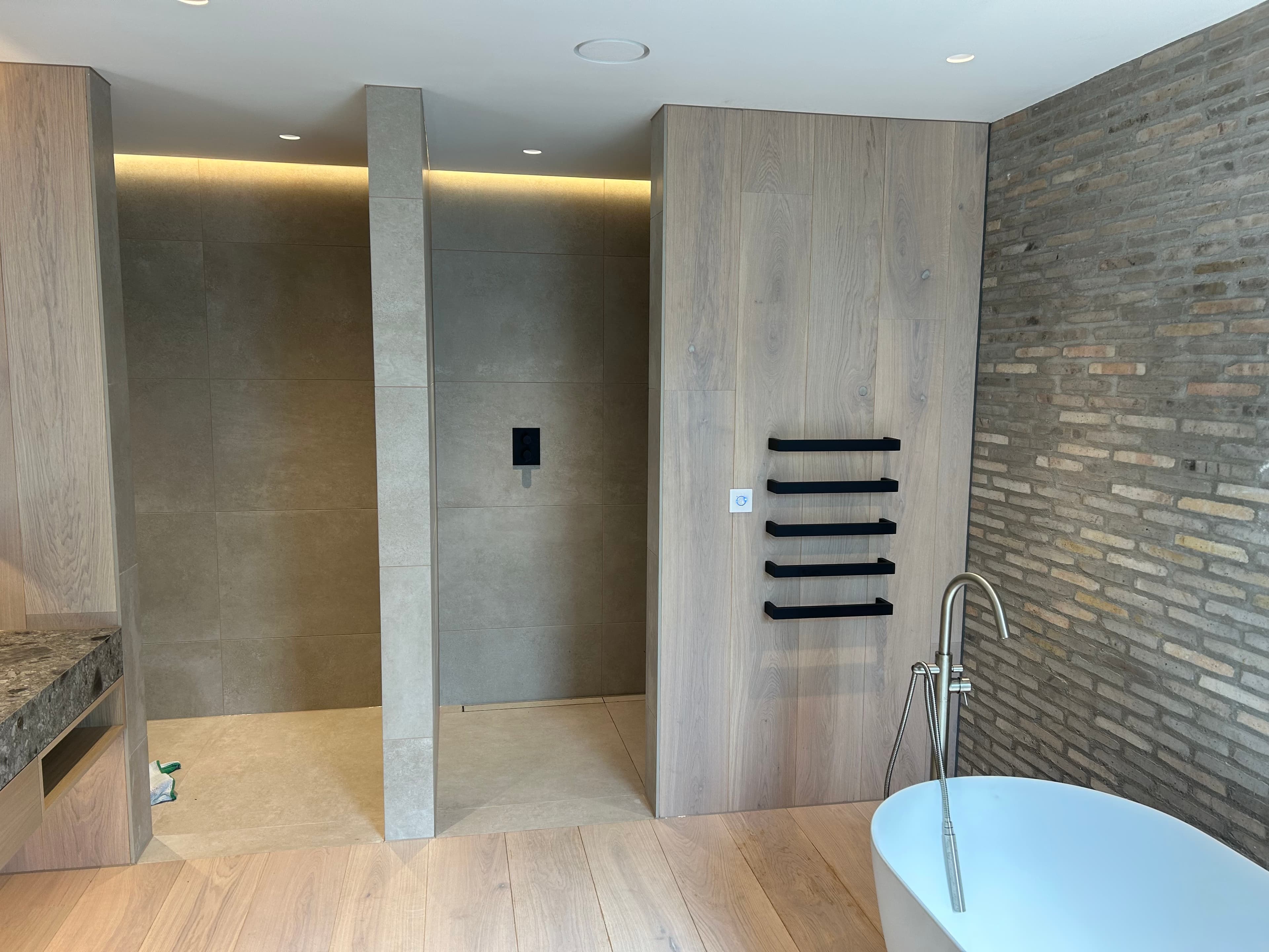 Oak-panelled vanity run with stone top